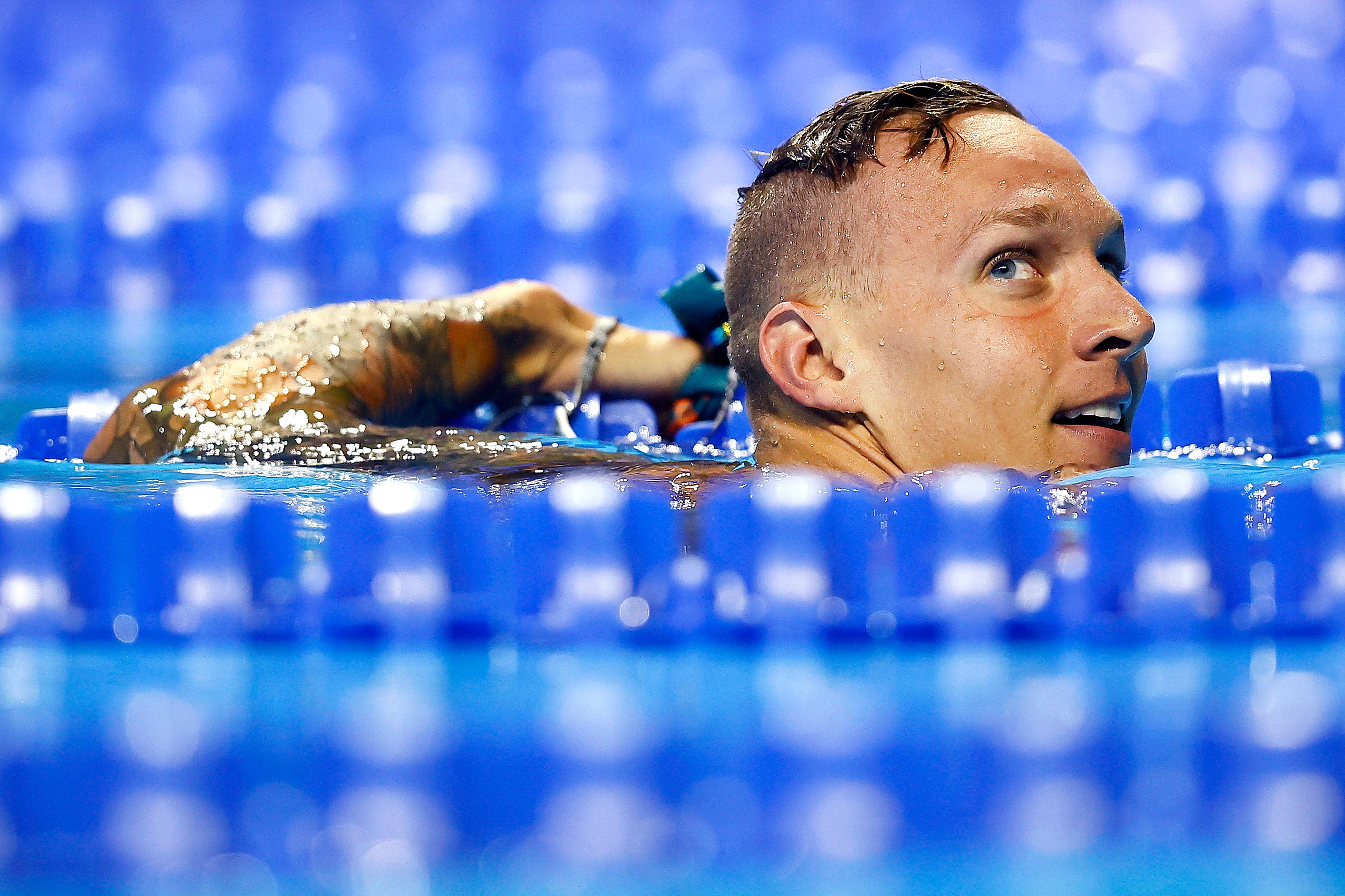 Caeleb Dressel of the United States reacts after competing in a preliminary heat for the MenÕs 100m butterfly during Day Six of the 2021 U.S. Olympic Team Swimming Trials at CHI Health Center on June 18, 2021 in Omaha, Nebraska.