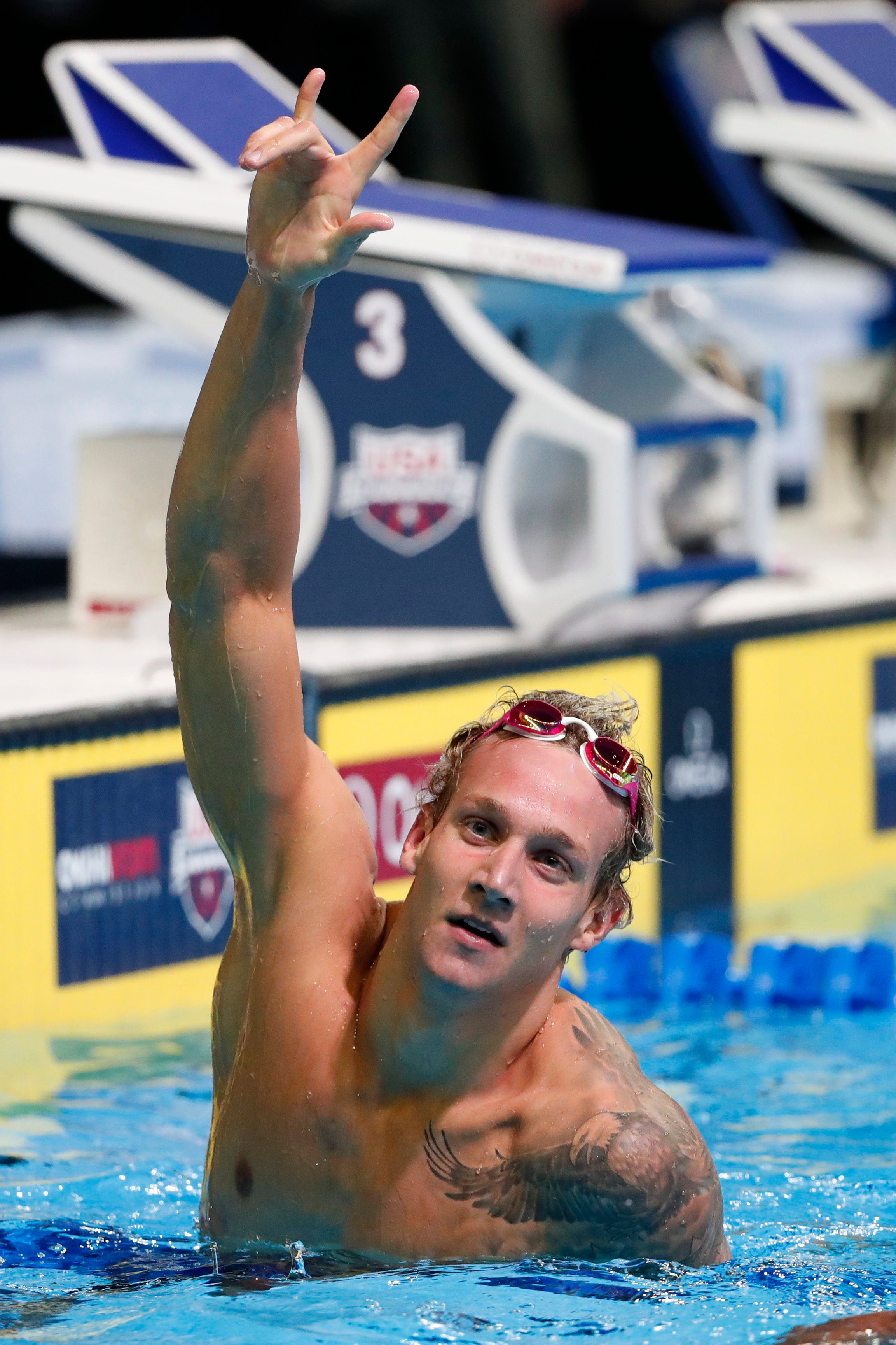 Caeleb Dressel celebrates after completing the Men's 100 Meter Freestyle finals in the U.S. Olympic swimming team trials at CenturyLink Center on June 30, 2016.