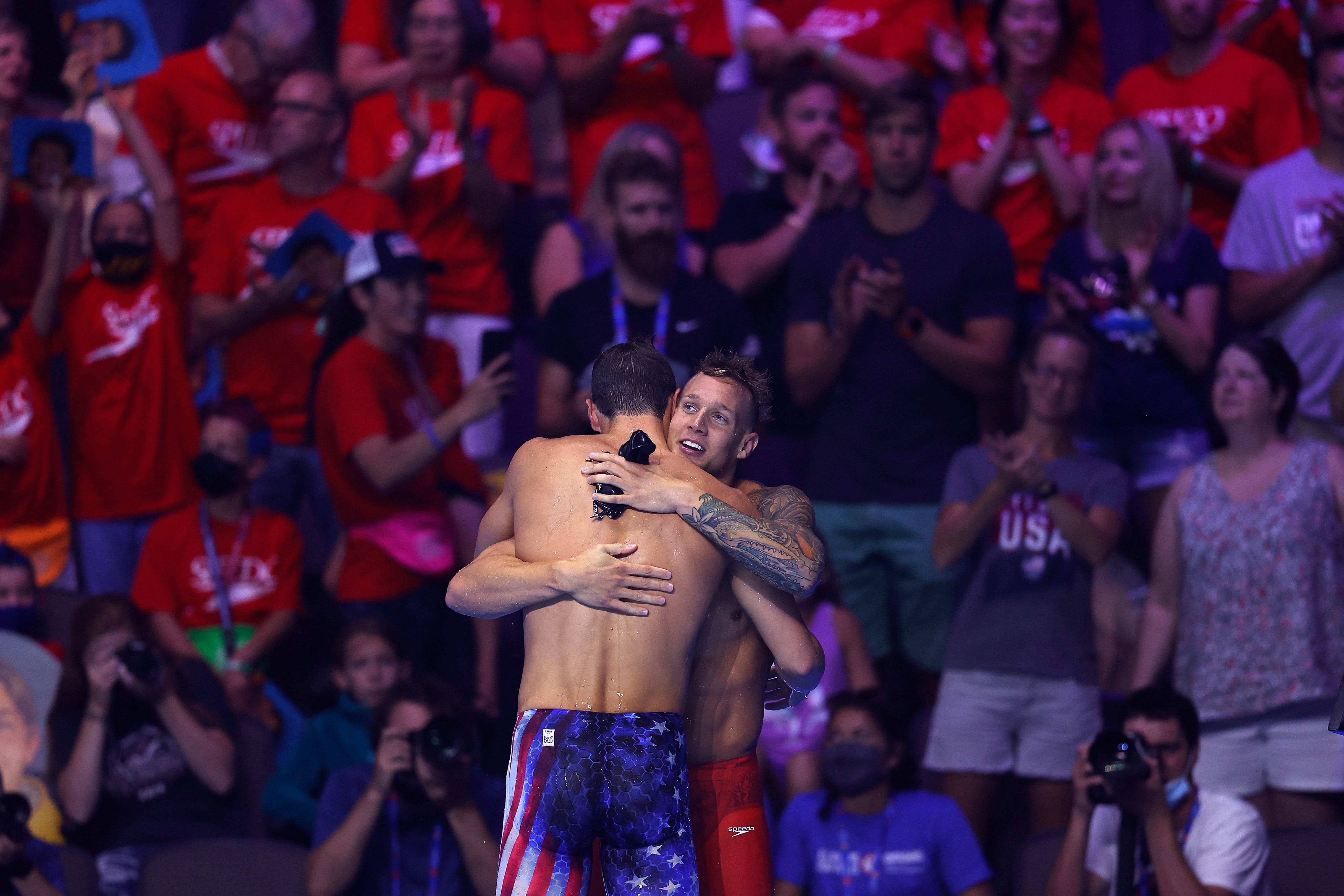 Caeleb Dressel and Michael Andrew of the United States reacts after competing in the Men's 50m freestyle final where Dressel set a new American Record during Day Eight of the 2021 U.S. Olympic Team Swimming Trials at CHI Health Center on June 20, 2021 in Omaha, Nebraska.