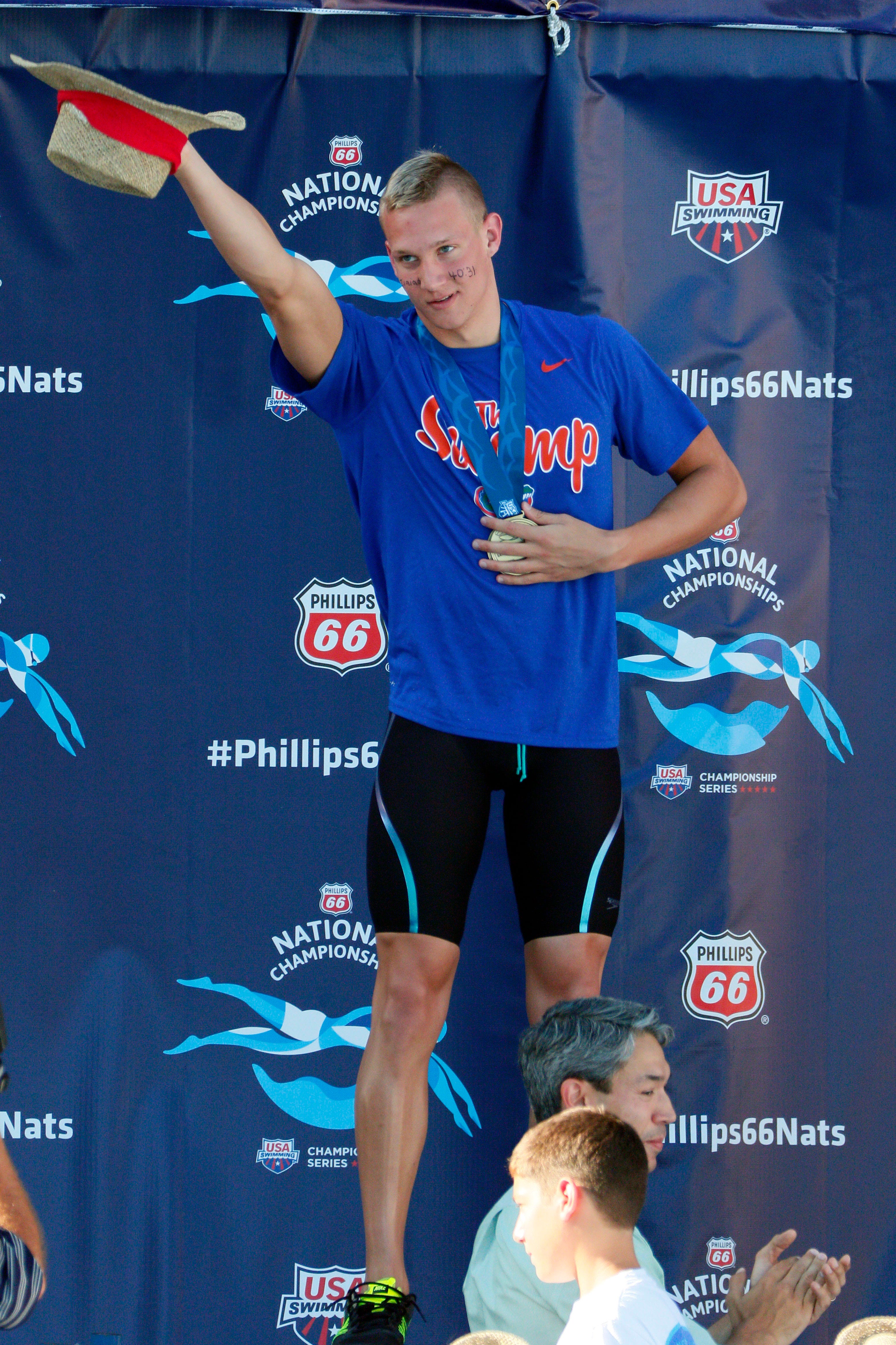 Caeleb Dressel celebrates winning the men's 100-meter butterfly final during the Phillips 66 National Championships at Northside Swim Center on Aug.  9, 2015.