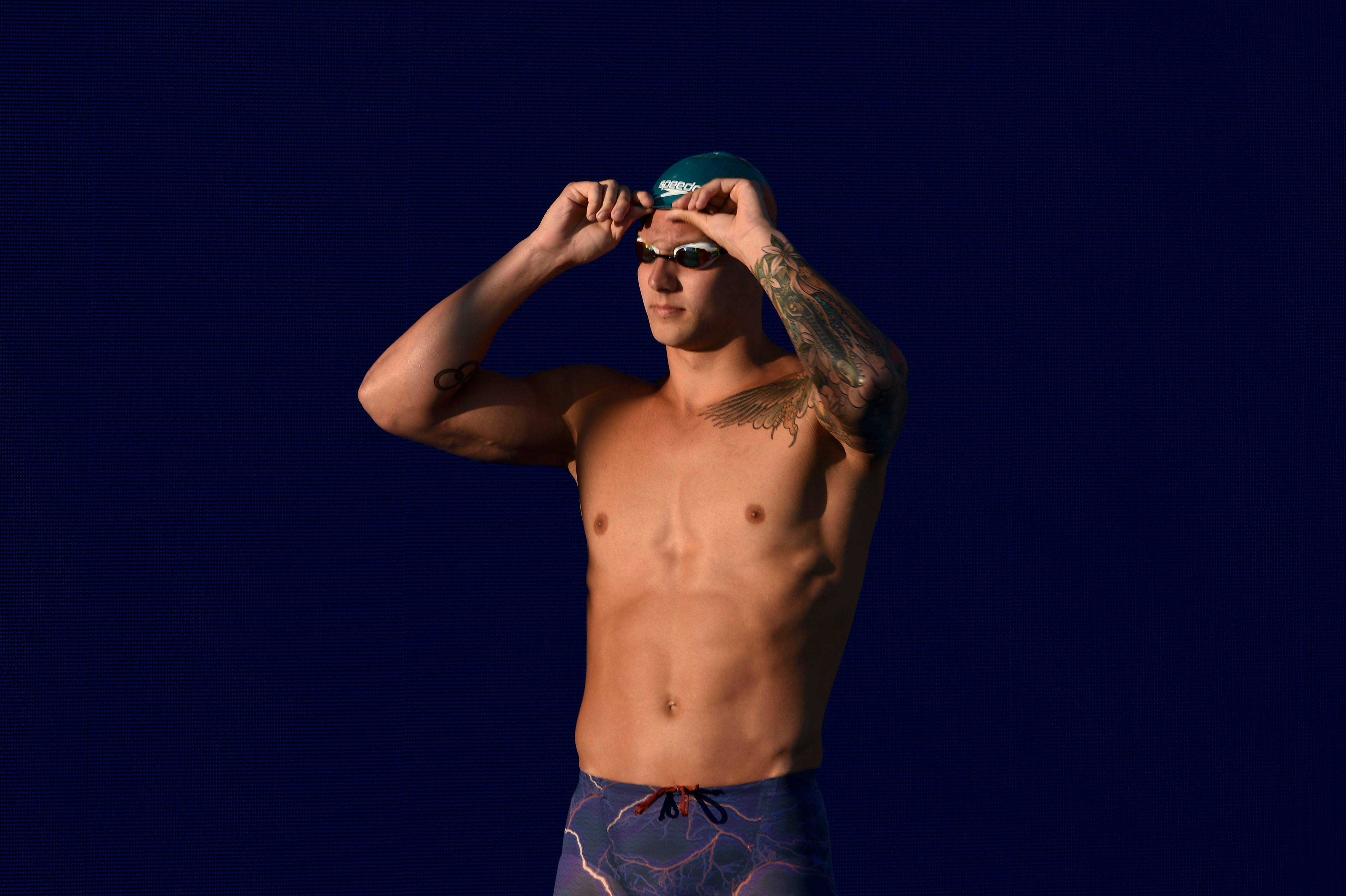 Caeleb Dressel prepares for the Men's 100 LC Meter Butterfly finals during the 2018 USA Swimming Phillips 66 National Championships swim meet at William Woollett, Jr. Aquatic Center on July 27, 2018.