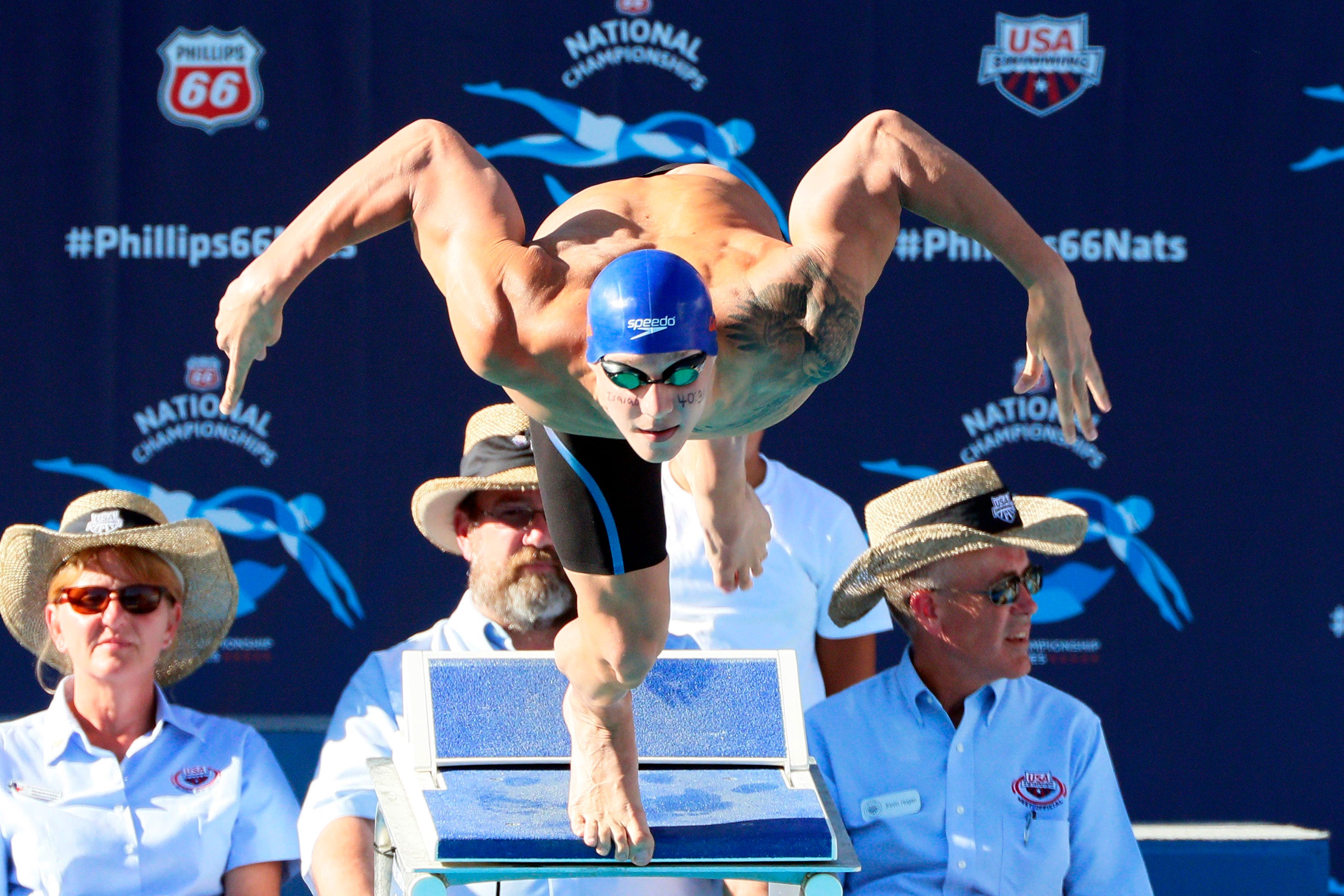 Caeleb Dressel dives in the men's 100-meter freestyle final during the Phillips 66 National Championships at Northside Swim Center on Aug. 9, 2015.