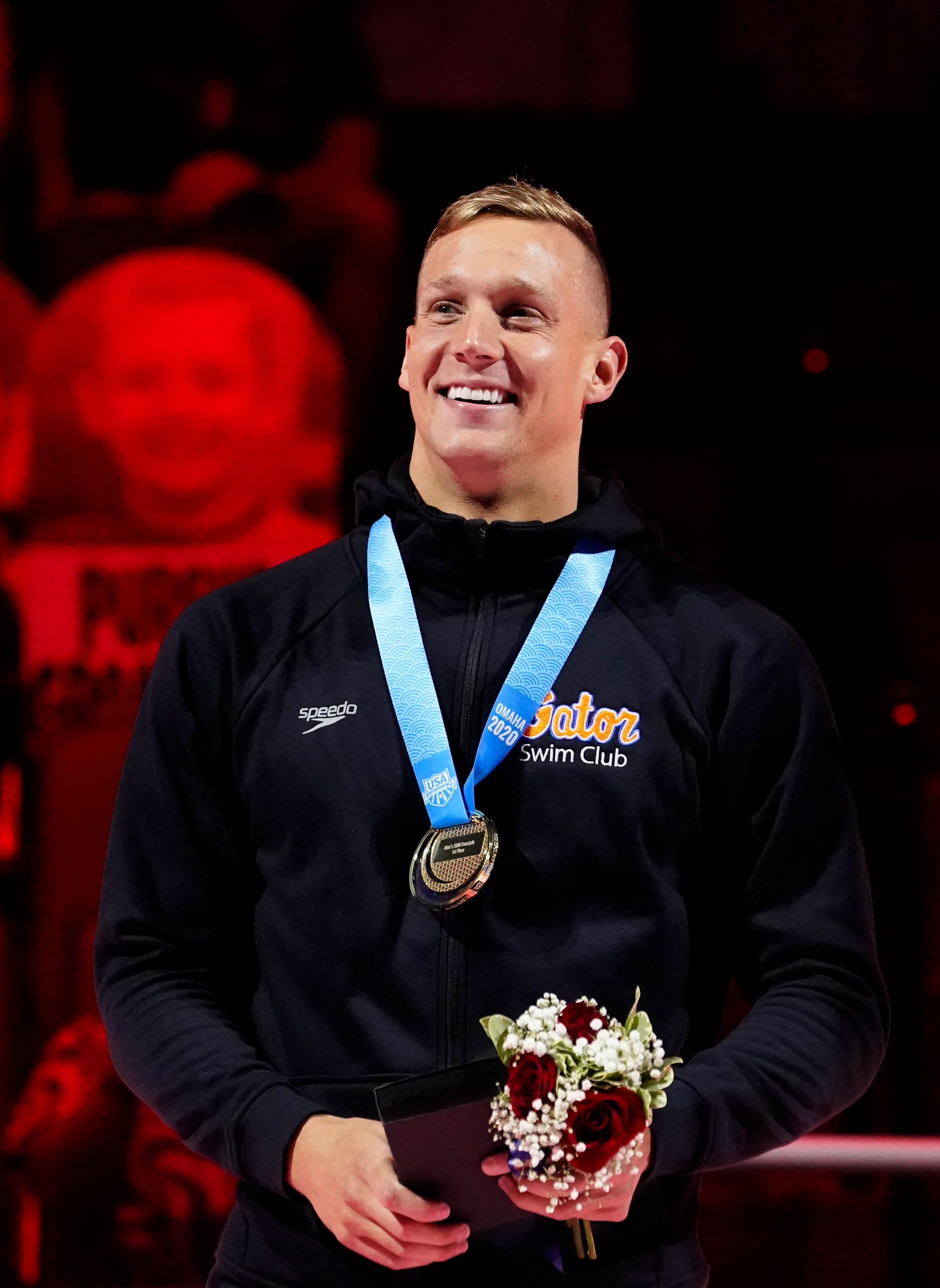 Caeleb Dressel celebrates after winning the men's 50m freestyle final during the U.S. Olympic Team Trials Swimming competition at CHI Health Center Omaha on June 20, 2021.