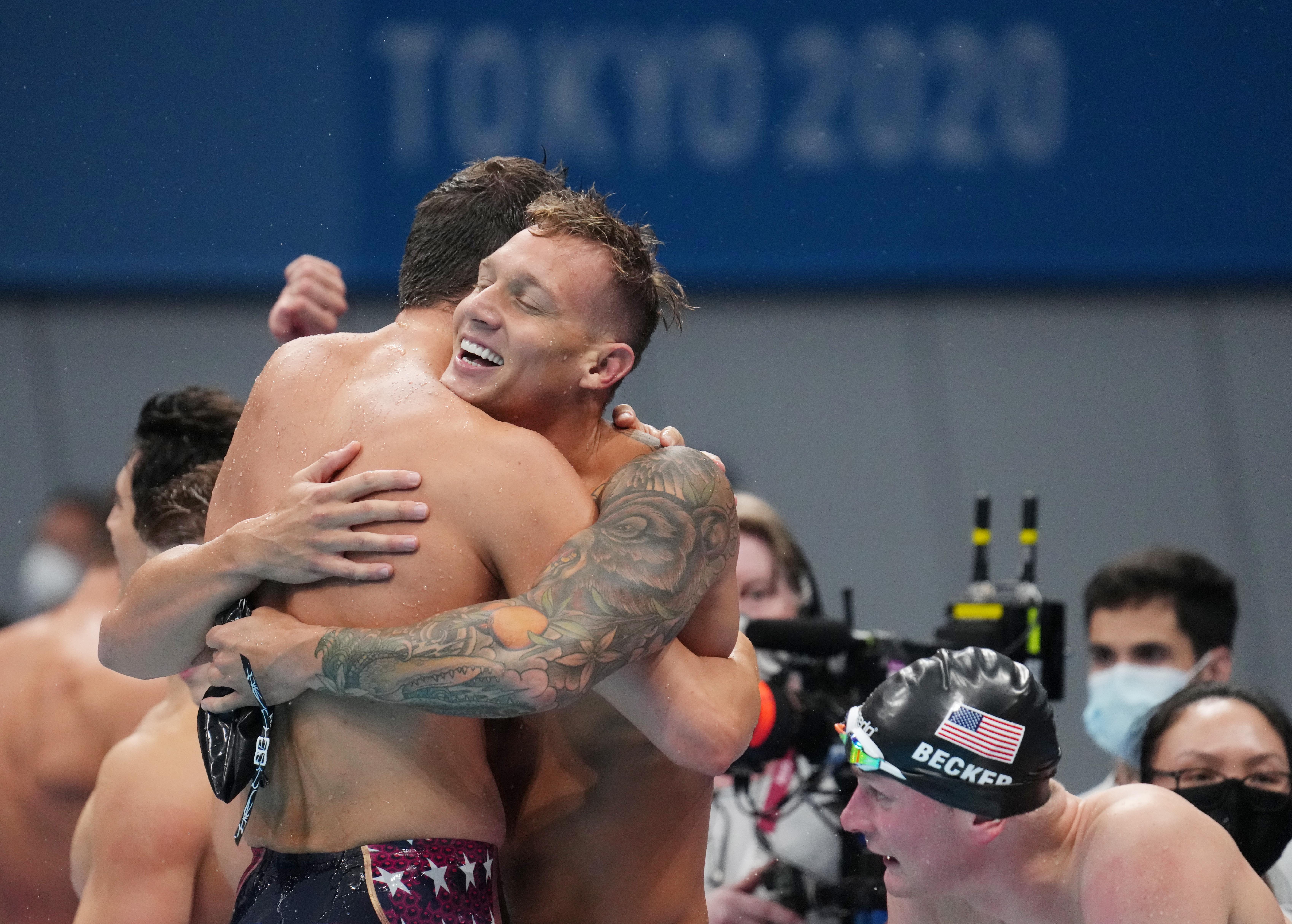 Zach Apple (USA) celebrates with Caeleb Dressel (USA) after winning the men's 4x100m freestyle relay final during the Tokyo 2020 Olympic Summer Games at Tokyo Aquatics Centre on July 26, 2021.