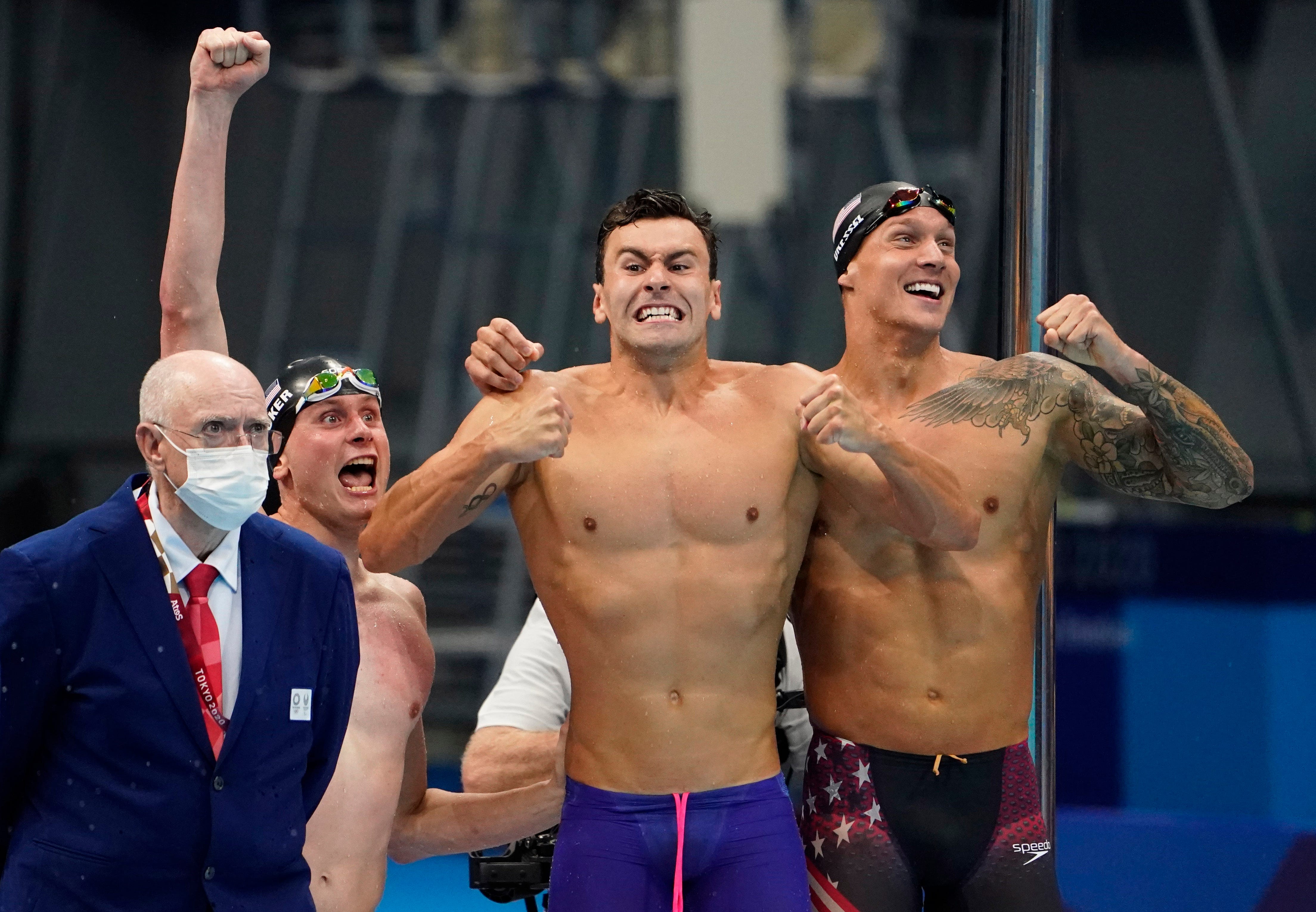 From left, Bowen Becker (USA), Blake Pieroni (USA) and Caeleb Dressel (USA) celebrate after winning the men's 4x100m freestyle relay final during the Tokyo 2020 Olympic Summer Games at Tokyo Aquatics Centre on July 26, 2021.